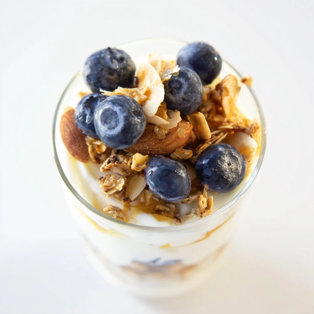 Freshly baked honey granola adds crunch to creamy lemon yogurt and sweet blueberries in this Lemon Blueberry Yogurt Parfait.