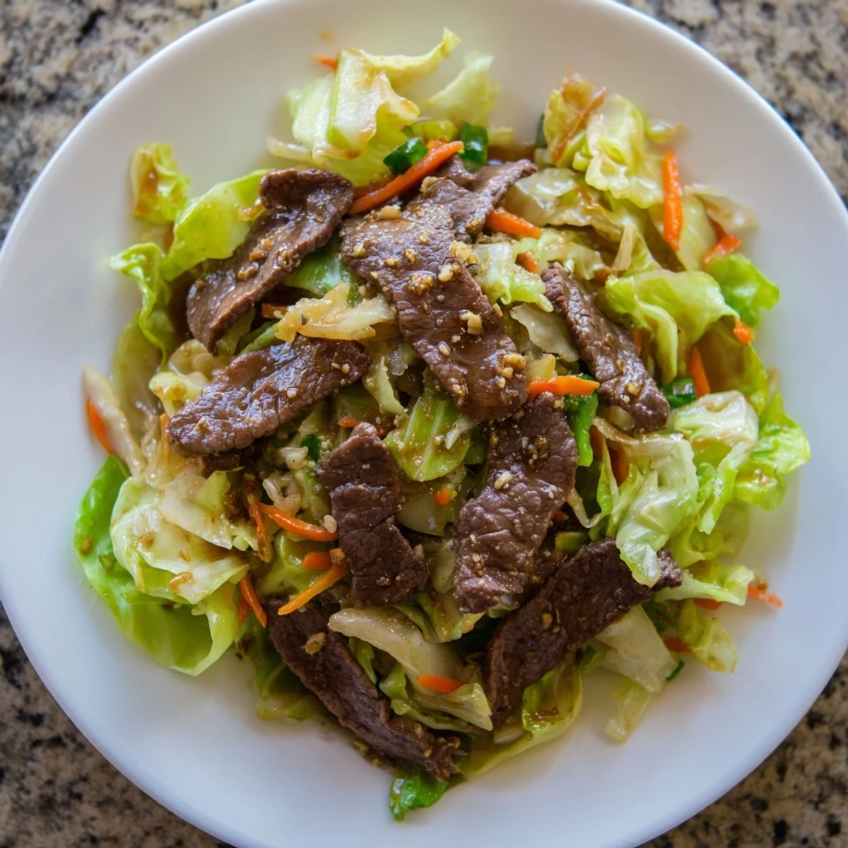 Sizzling Green Cabbage and Beef Stir Fry tossed with garlic and ginger, perfect over steamed rice.