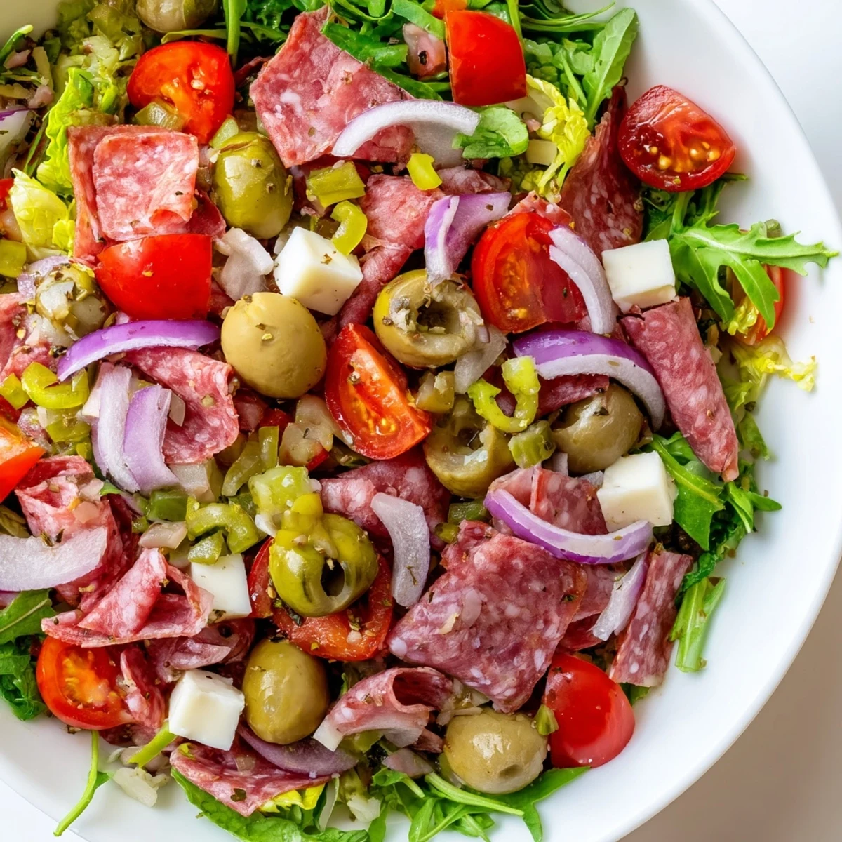 Tossed with a tangy olive dressing, this hearty salad combines crisp romaine with savory Italian flavors.