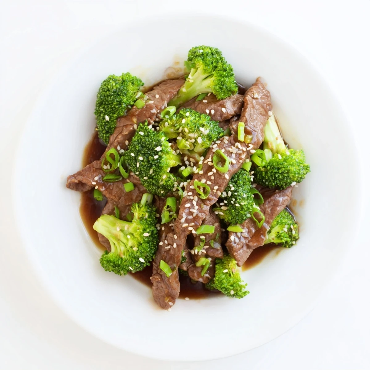 Sliced beef and crisp broccoli tossed in an aromatic ginger glaze, served steaming over a fluffy bed of white rice.