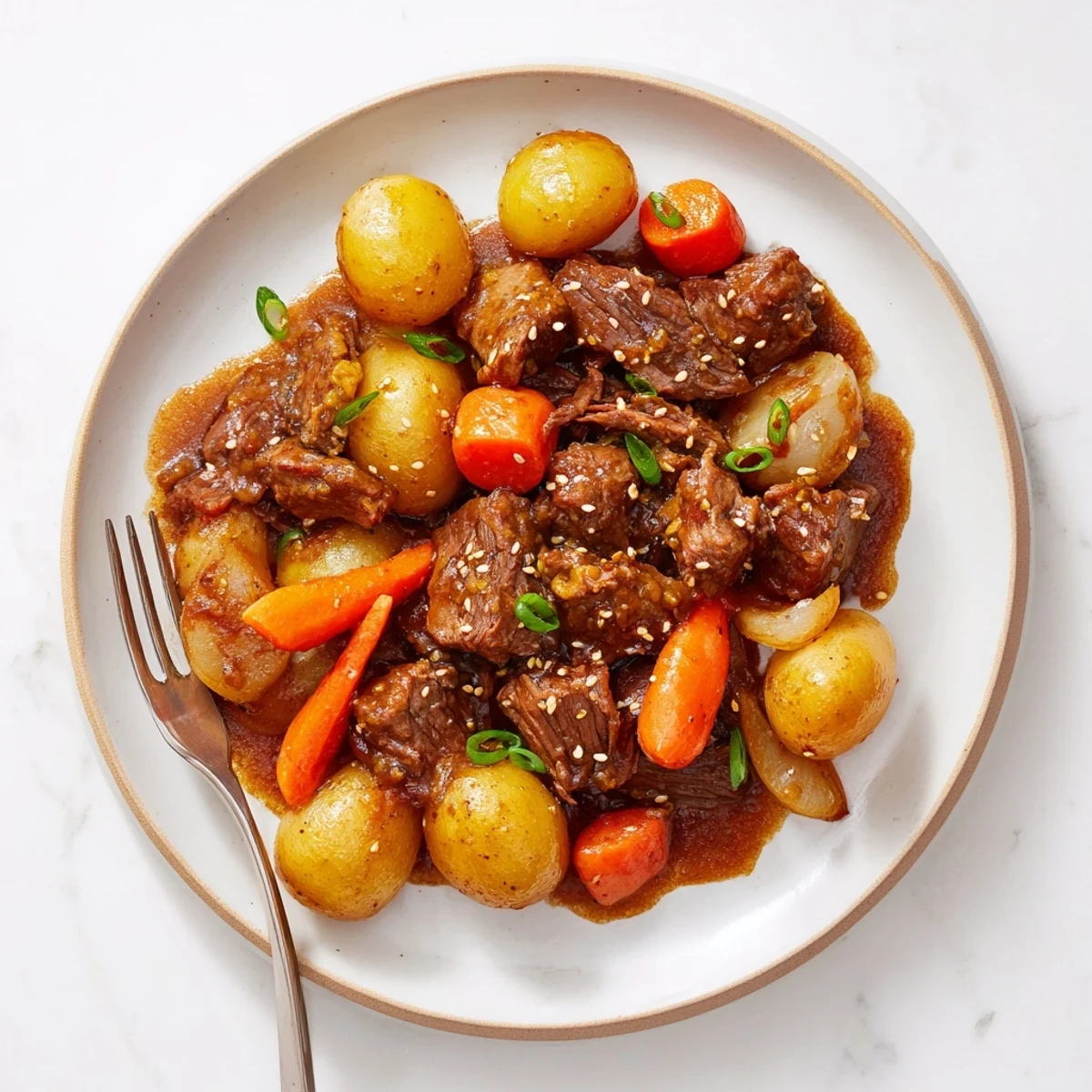 Slow cooker Korean beef pot roast with tender shredded meat and vegetables in soy garlic gravy
