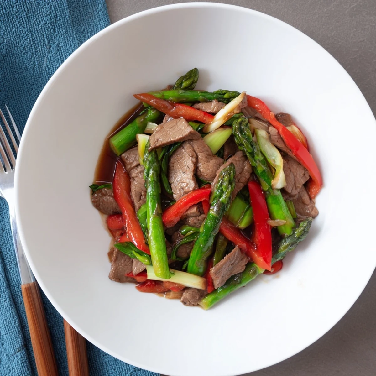 Golden soy beef strips with crisp bok choy and asparagus in glossy stir-fry sauce