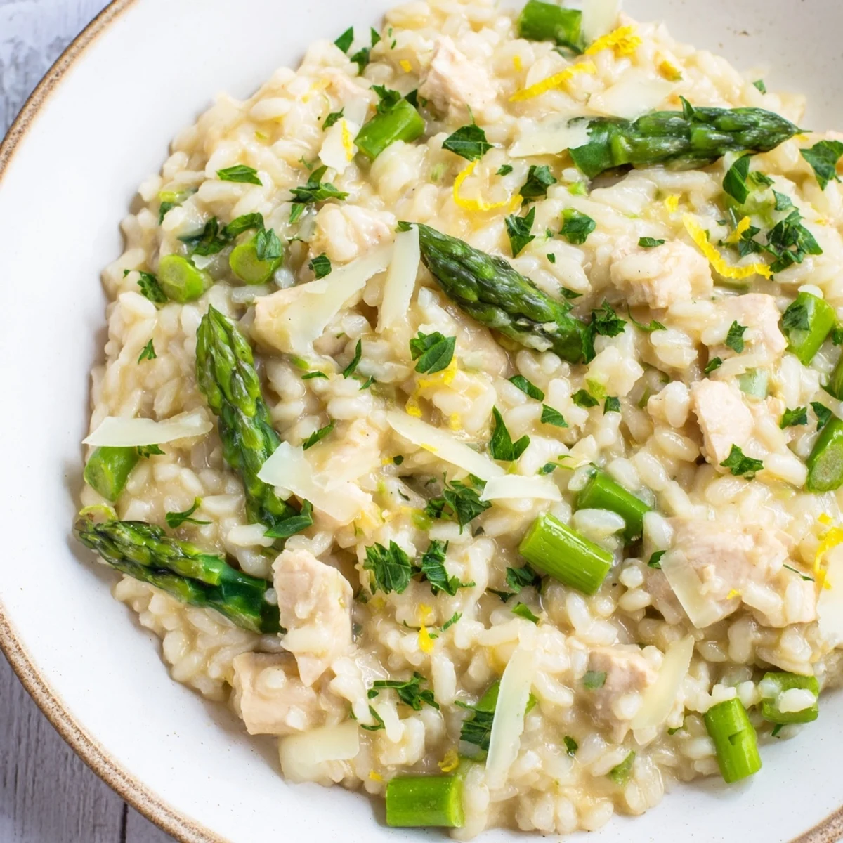 Golden chicken pieces and tender asparagus mixed into rich Italian Arborio rice with lemon zest garnish