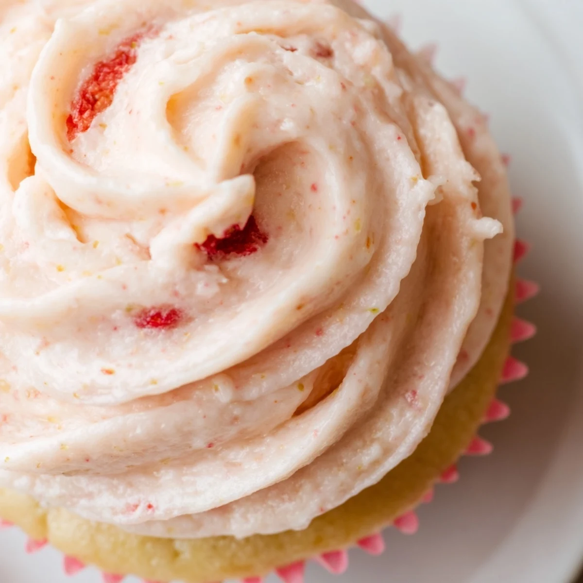 Moist strawberry lemonade cupcakes piled high with creamy tangy lemon strawberry buttercream
