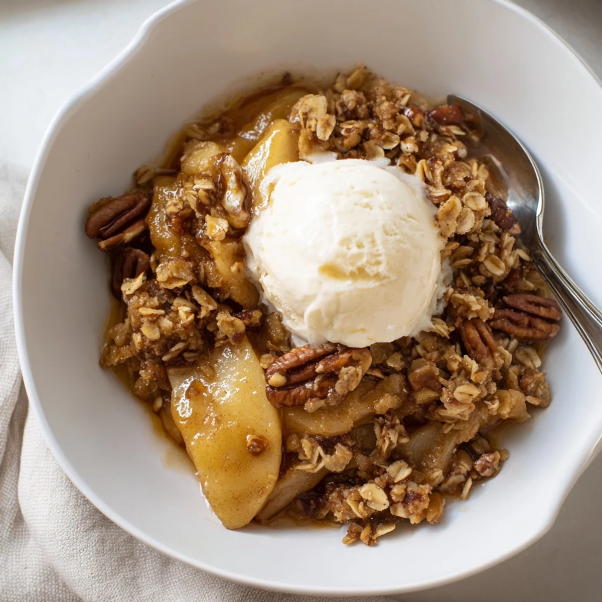 Warm crockpot apple crisp with bubbling cinnamon apples and a golden oat topping