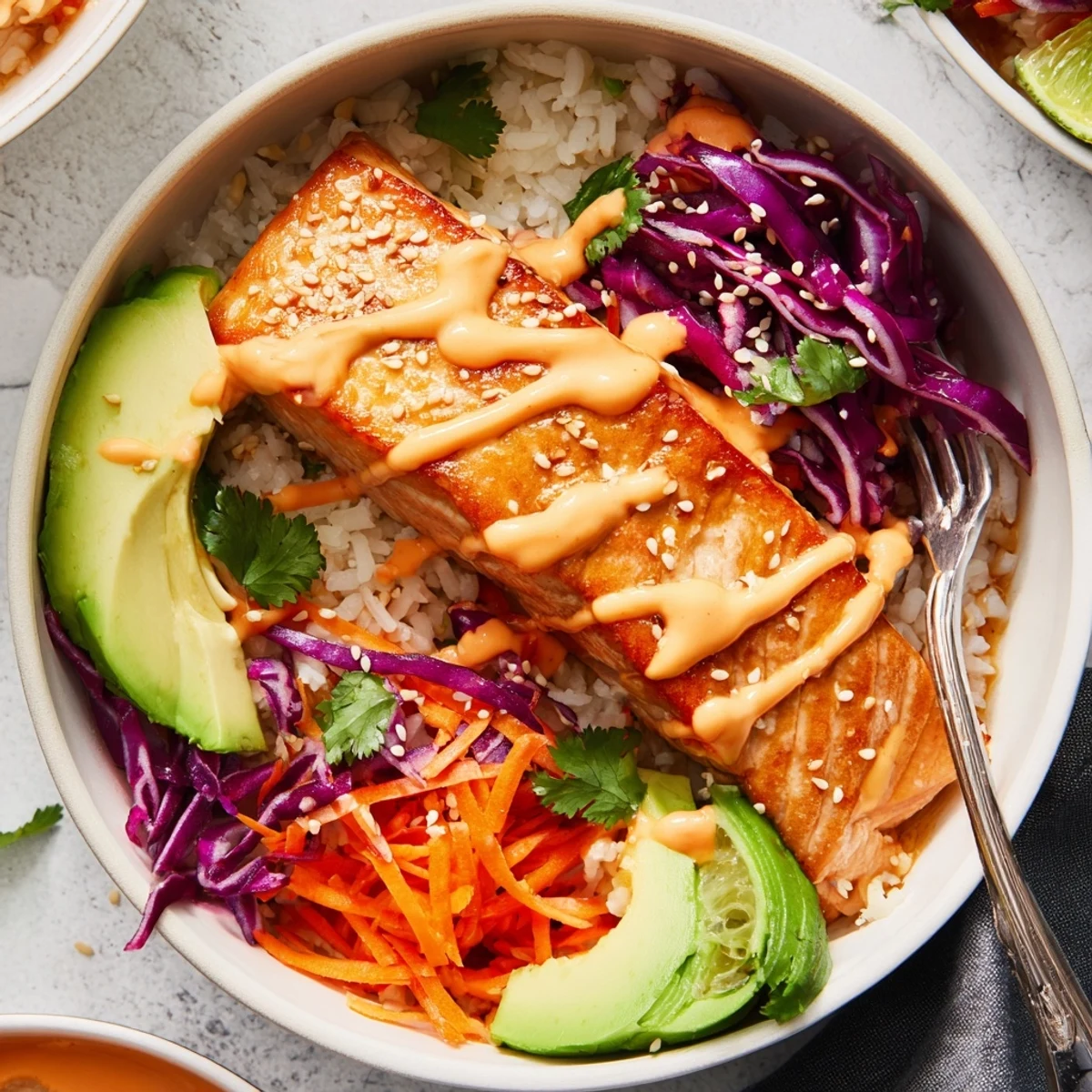 Bang Bang Salmon Bowls Recipe with roasted salmon, creamy sauce, vibrant vegetables