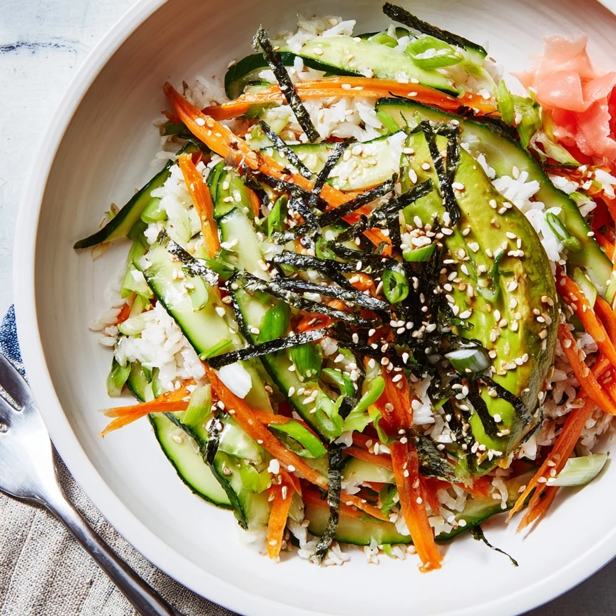 Chilled Sushi Cucumber Salad with nori strips, sesame crunch, tangy-sweet dressing