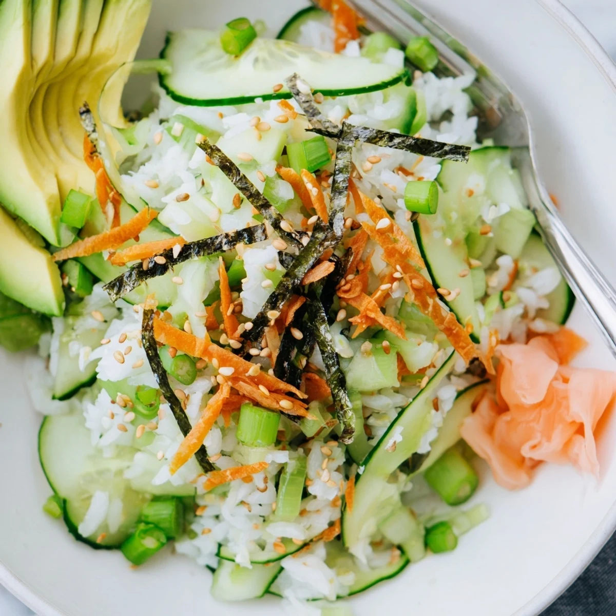 Bright Sushi Cucumber Salad tossed with rice vinegar dressing, sliced avocado optional