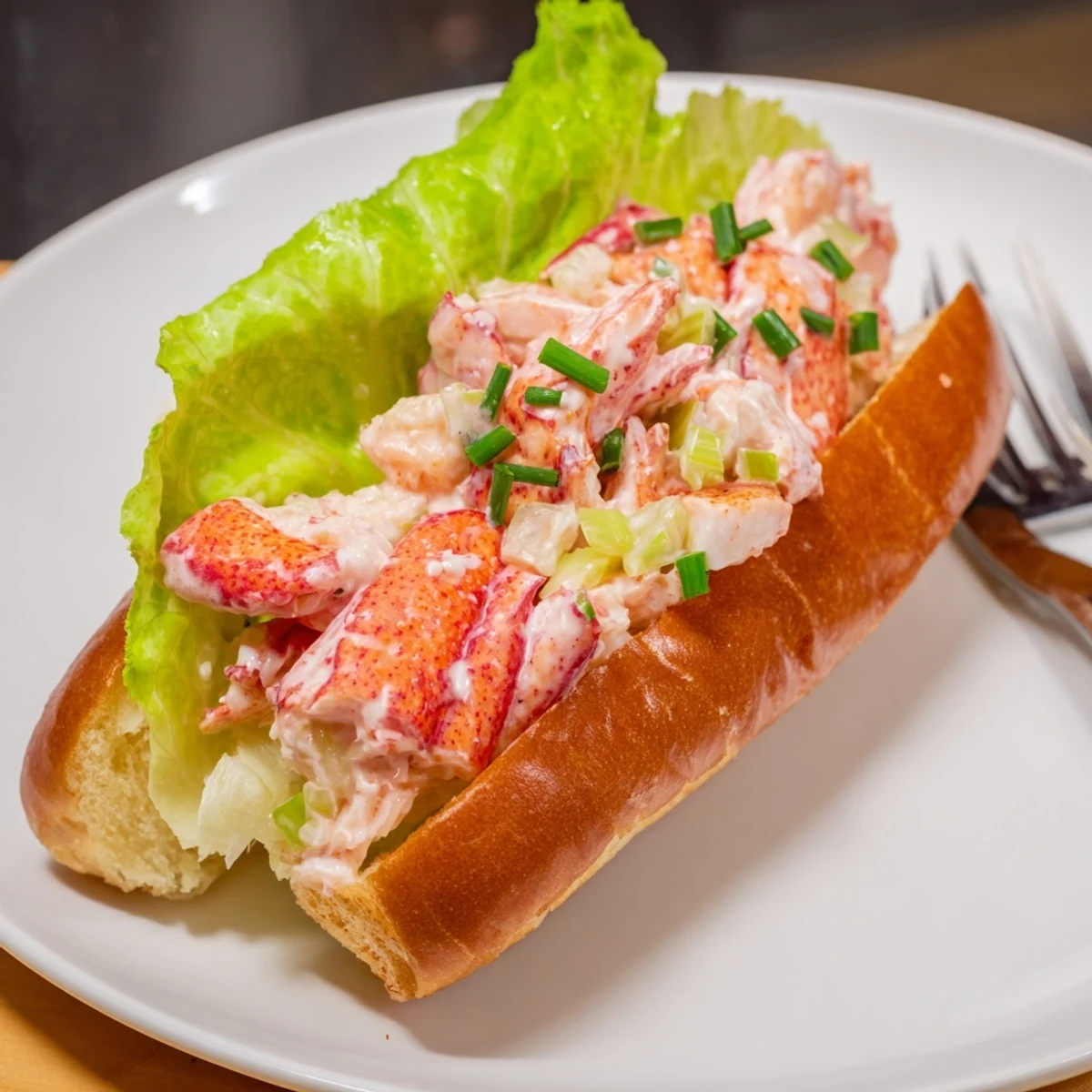 Golden buttery toasted split-top bun overflowing with sweet Maine lobster meat dressed in light mayonnaise