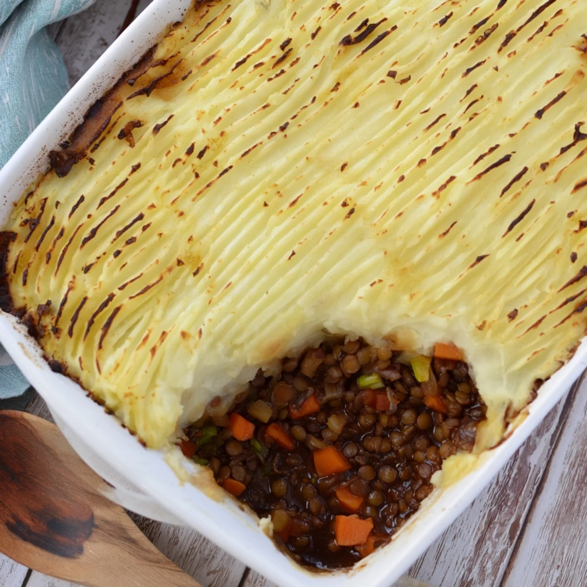 Hearty lentil and caramelized onion shepherd's pie baked to golden perfection
